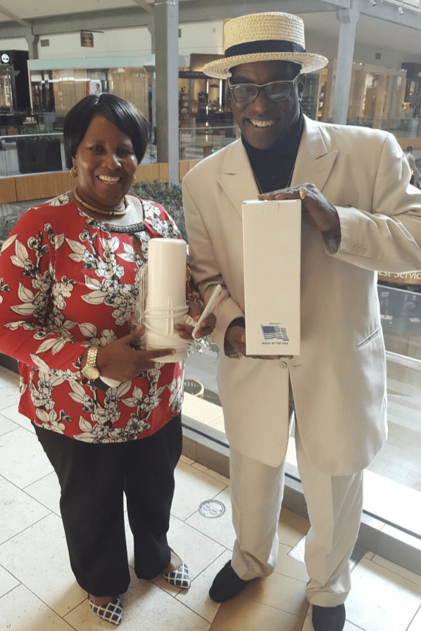 A man in a hat and a woman in a hat.