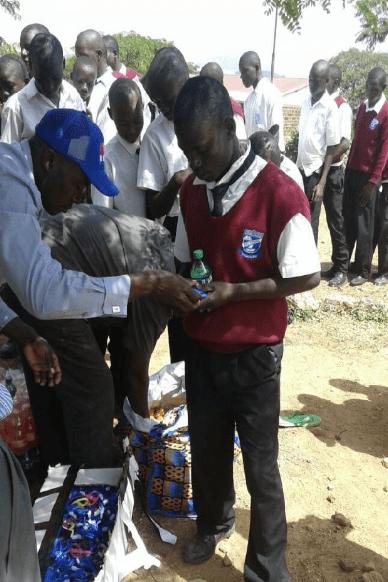 A group of people standing in a field.