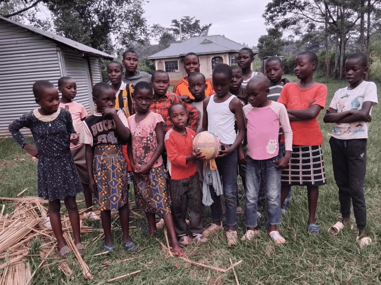A group of people standing in front of a blackboard.