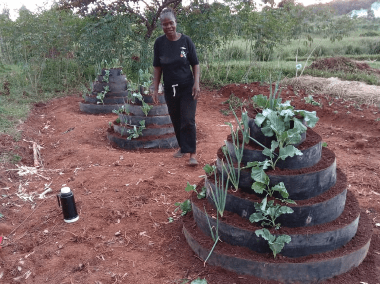 A group of people standing in front of a blackboard.